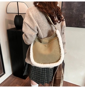 Detail of khaki shoulder bag with white faux fur trim and matte leather finish for autumn