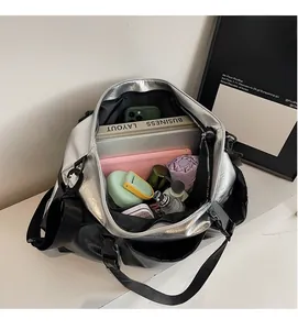 Top view of large silver and black tote bag showing spacious interior and storage