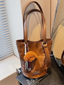 Women Vintage PU Leather Bucket Bag Pleated Shoulder Bag With Plush Teddy Dog Charm And Braided Tassel Daily Handbag