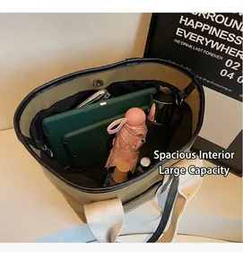Top view of olive canvas tote bag interior showing capacity for iPad and umbrella