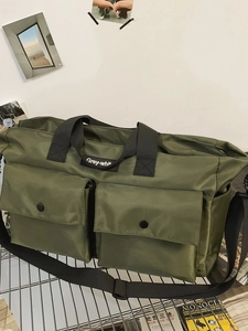 Army green nylon tote bag with double front pockets and adjustable shoulder strap
