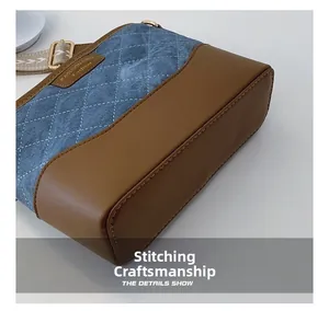 Detailed view of quilted denim and leather patchwork crossbody bag with metal buckles