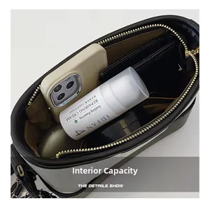 Detail showing the internal capacity of the two-tone crocodile pattern bucket bag