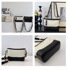 Detailed views of bucket bag with stone texture, contrast colors and metal chain strap