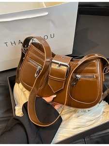 Brown vintage oil wax leather shoulder bag with multiple zippers and metal buckle details