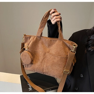 Brown corduroy tote bag with small round coin purse and adjustable strap details