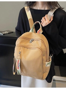 Casual khaki travel backpack with ethnic print straps and large capacity for students