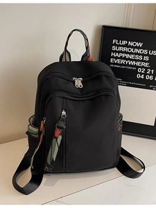 Fashionable black travel backpack with colorful ethnic woven straps and large capacity