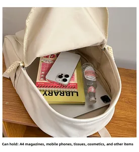 Interior view of cream PU leather backpack showing large capacity for laptop and A4 magazine