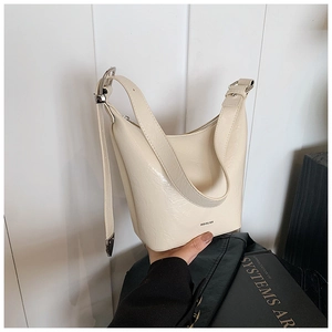 Detail of cream leather shoulder bag with NO FILTER print and adjustable silver buckle