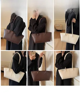 Detailed views of minimalist dark brown and cream tote bags shown on model