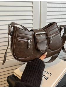 Vintage dark brown faux leather shoulder bag with dual front zippers and buckle