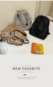 Three nylon backpacks in khaki, grey, and black arranged on a bed in a home setting