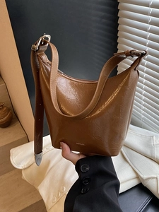 Retro brown wrinkled leather bucket bag with shoulder strap and NO FILTER lettering