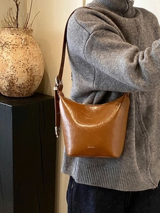 Retro brown leather underarm shoulder bag with 'NO FILTER' logo and adjustable strap