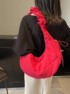 Hot pink quilted hobo bag for women with a scrunchie shoulder strap and crescent shape