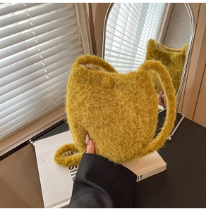 Detailed texture of bright yellow faux fur bucket bag with soft plush finish and handle