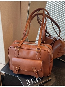 Vintage brown PU leather briefcase with dual handles and front buckle pocket in mirror view