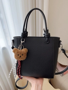 Black lychee pattern bucket bag with double handles and cute brown teddy bear charm