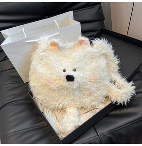 Detail of plush puppy bag in black gift box with high-quality soft faux fur texture