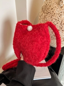 Women's red fuzzy knit bucket bag with white pom-pom for chic autumn winter commuting
