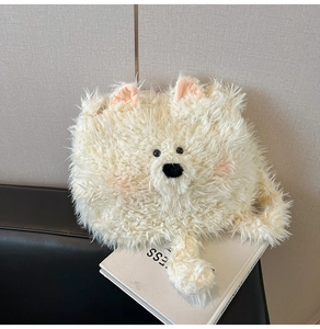 Close-up of soft plush puppy bag material with pink ears and cute beaded eyes