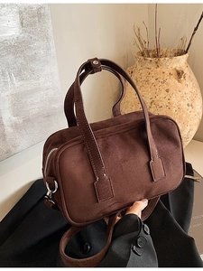Deep brown matte suede tote bag with top handles and adjustable shoulder strap