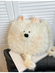 Cute white fluffy dog-shaped backpack with soft fur and pink ears in a stylish setting