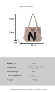 Detailed size chart of large off-white canvas tote bag with black N letter and dimensions
