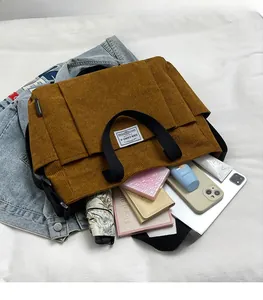 Brown corduroy tote bag showing large capacity for tablet, umbrella and daily essentials