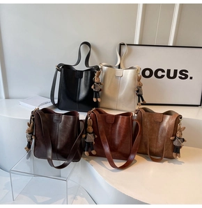 Detail view of large capacity bucket bags in five colors with cute rabbit charms