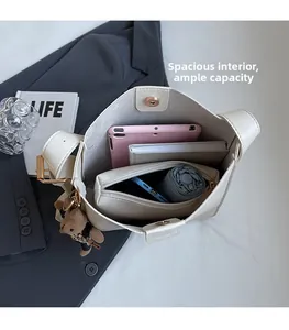 Top view of large white tote bag showing spacious interior with tablet and daily essentials