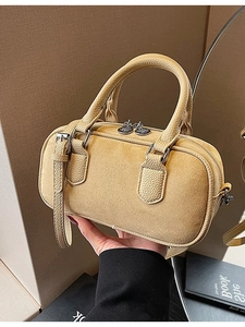 Fashionable mustard yellow barrel crossbody bag with twin handles and detachable shoulder strap