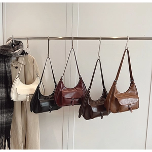 Detailed display of vintage half-moon shoulder bags in five classic autumn colors