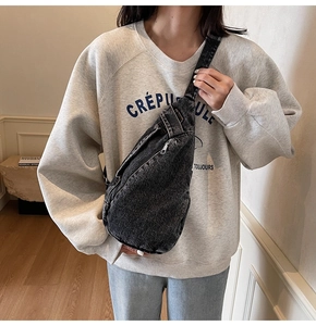 Fashionable washed denim crossbody bag for women showing large capacity and metal zipper