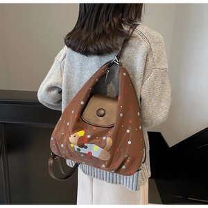 Brown oil wax leather backpack with colorful polka dots and cute dog embroidery detail