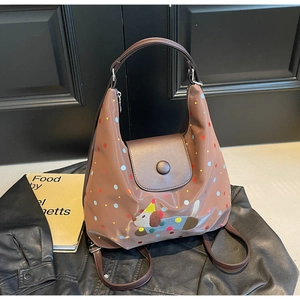 Detail of vintage brown tote bag with colorful dots and cartoon dog illustration decoration
