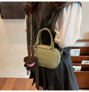 Olive green leather mini bag with MAUDAI BEAR embossing and brown plush dog charm