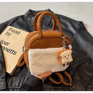 Brown suede handbag featuring a white faux fur pocket and a cute toast bread plush charm