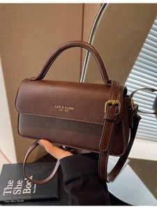 Vintage dark brown faux leather crossbody bag with gold logo and adjustable strap