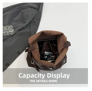 Detail of spacious dark brown tote interior with magnetic clasp and soft lining