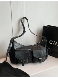 Chic black faux leather shoulder bag with double pockets and adjustable wide strap