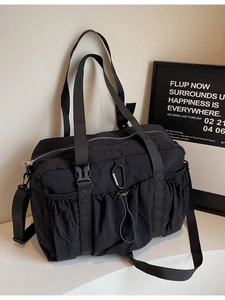 Fashionable black high-capacity bucket travel bag with multiple tactical pockets
