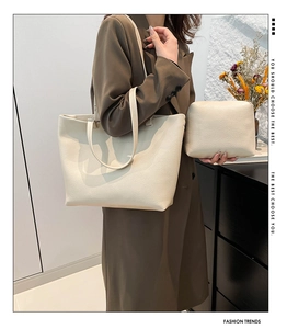 Detail view of large cream tote bag set with matching pouch and lychee grain texture
