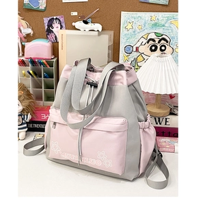 Detail view of pink and grey canvas backpack with drawstring and star pattern