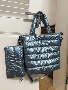 Chic metallic blue quilted tote bag with matching pouch and adjustable shoulder strap