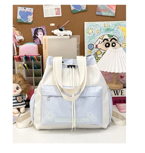 Detail of blue and white canvas tote bag with front zipper pocket and MUFA LLUO text