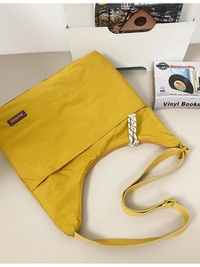 Fashionable yellow nylon crossbody bag with MACHUGE label and adjustable wide strap