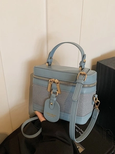Retro light blue leather and canvas bucket bag with gold zipper and top handle