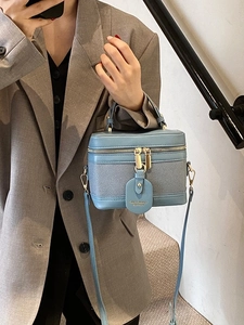 Retro light blue bucket bag with leather texture and gold hardware for women